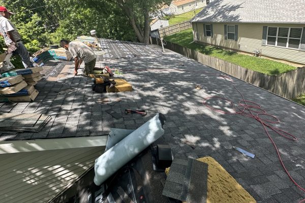 IMG_5269 Roofers working for Pantheon Roofing Solutions preparing to replace a roof in Champaign, IL