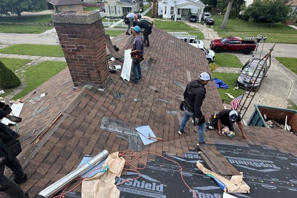 roofers-replacing-roof-champaign-il Roofers replacing a roof in Champaign, IL