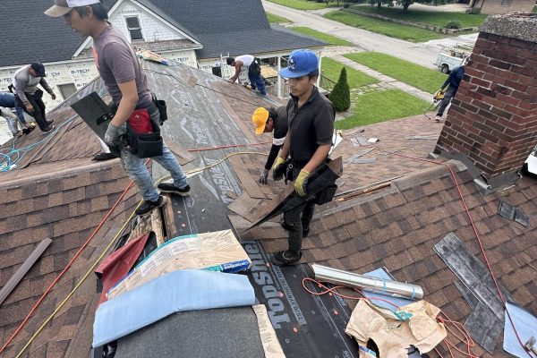 roofers-working-roof-replacemnt-pantheon-roofing-solutions Roofers working on a roof replacemnt - Pantheon Roofing Solutions