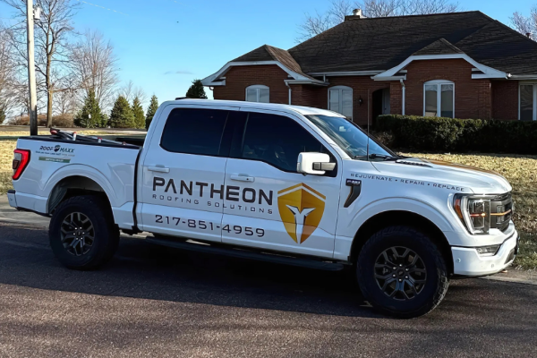 1 Photo of Pantheon Roofing truck next to finished roofing replacement in Champaign IL