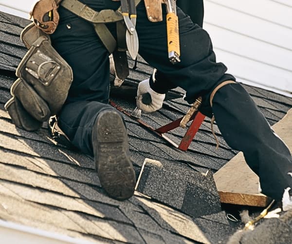 Licensed Pantheon roofer working on a Champaign-Urbana home