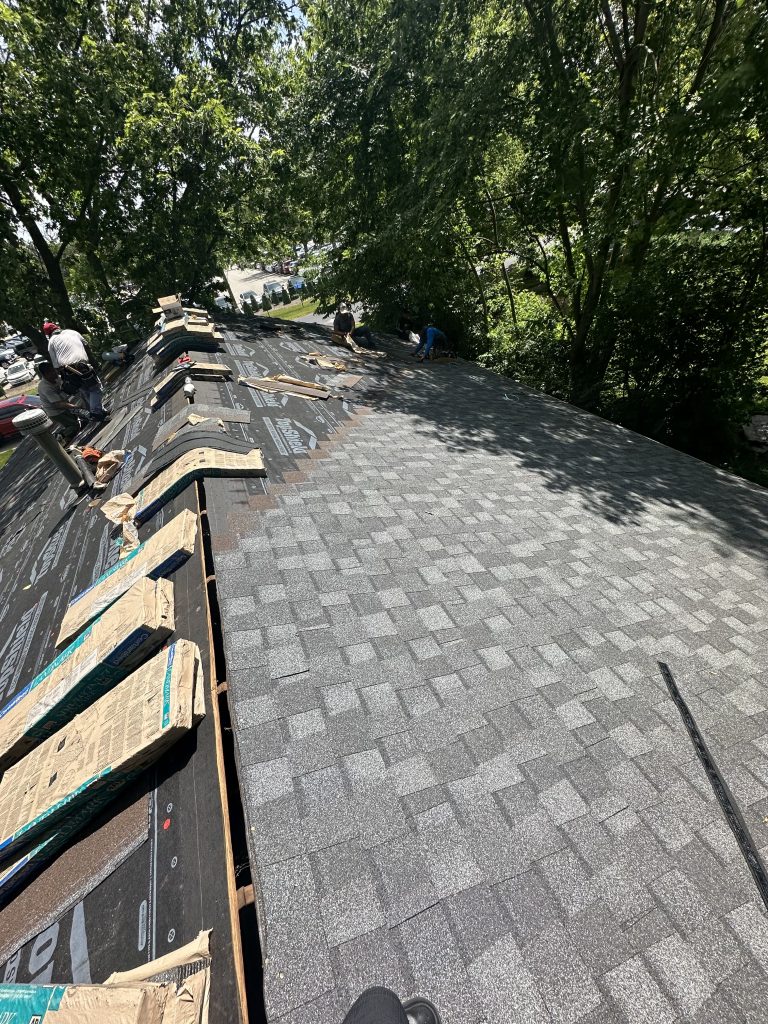 Pantheon Roofing Solutions working on a roof in Champaign, IL