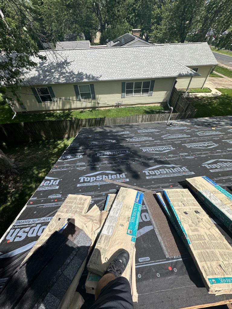 Roofing supplies laid out on a roof in Urbana, IL