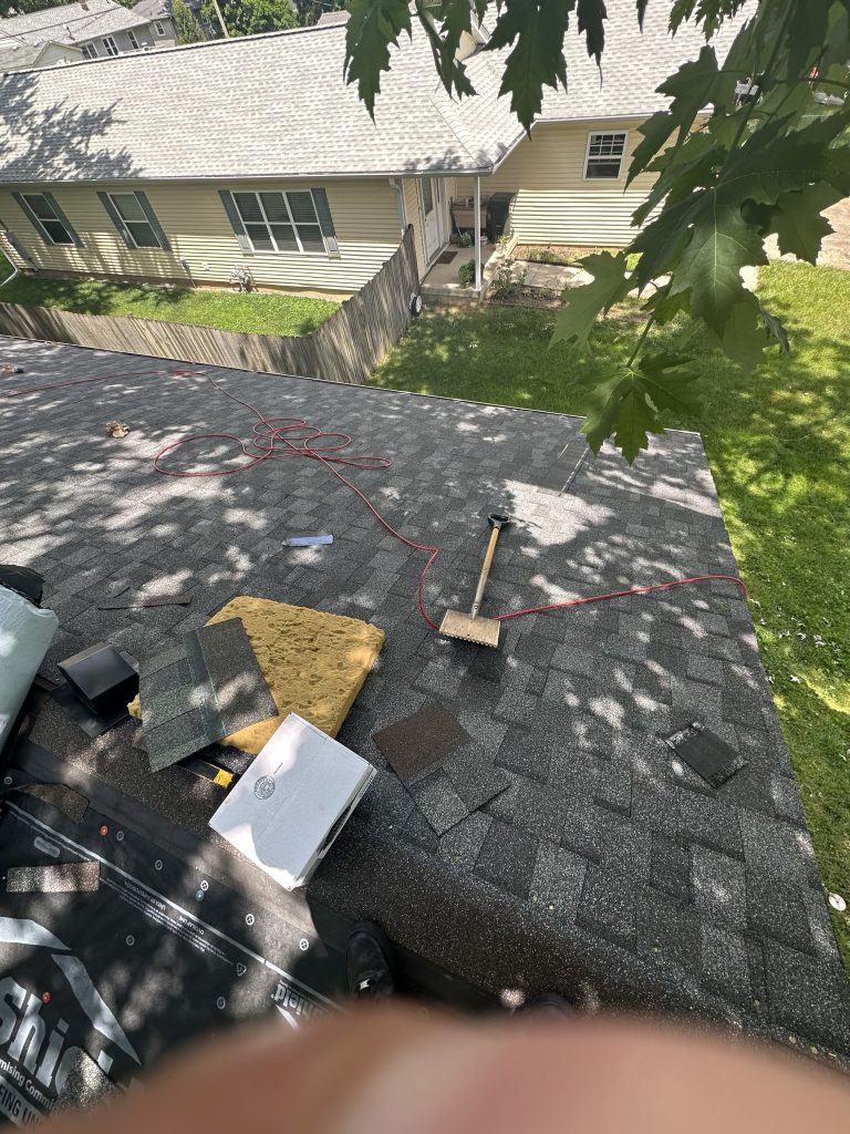 View from a roof and roofers preparing to work on a roof in Champaign, IL area