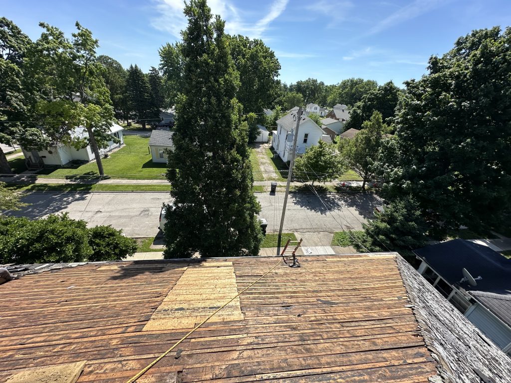 Pantheon Roofing Solutions working on a roof in Champaign, IL